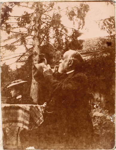 Albert Bartholomé - Degas assis à table dans un jardin avec une jeune femme au c...