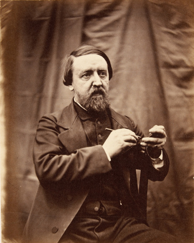 Achille Bonnuit - Homme barbu assis, tenant un crayon