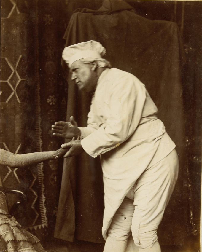 François Brunery - Homme vêtu en mitron penché vers un mannequin féminin de bois...