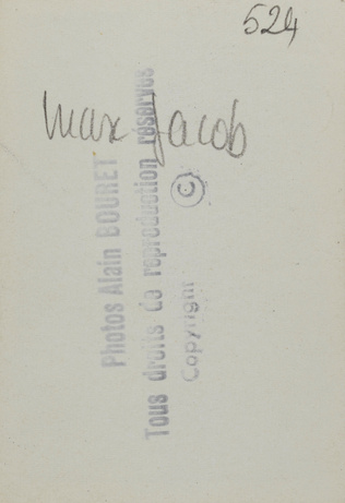 Anonyme - Max Jacob en redingote et haut-de-forme, appuyé sur une canne