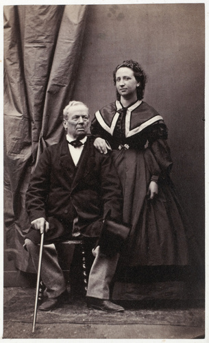 Achille Bonnuit - Homme agé assis à côté d'une jeune femme en pied (un père et s...