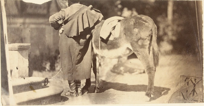 Edmond Lebel - Edmond Lebel (?), vêtu à l'italienne de dos, près d'un âne