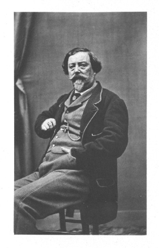 Achille Bonnuit - Homme barbu assis, main gauche dans la poche de son pantalon