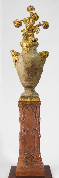 Georges Hoentschel-Torchère (d'une paire) en deux éléments : vase en grès flammé monté d'un bouquet de pavots en bronze doré et monté sur une gaine en orme